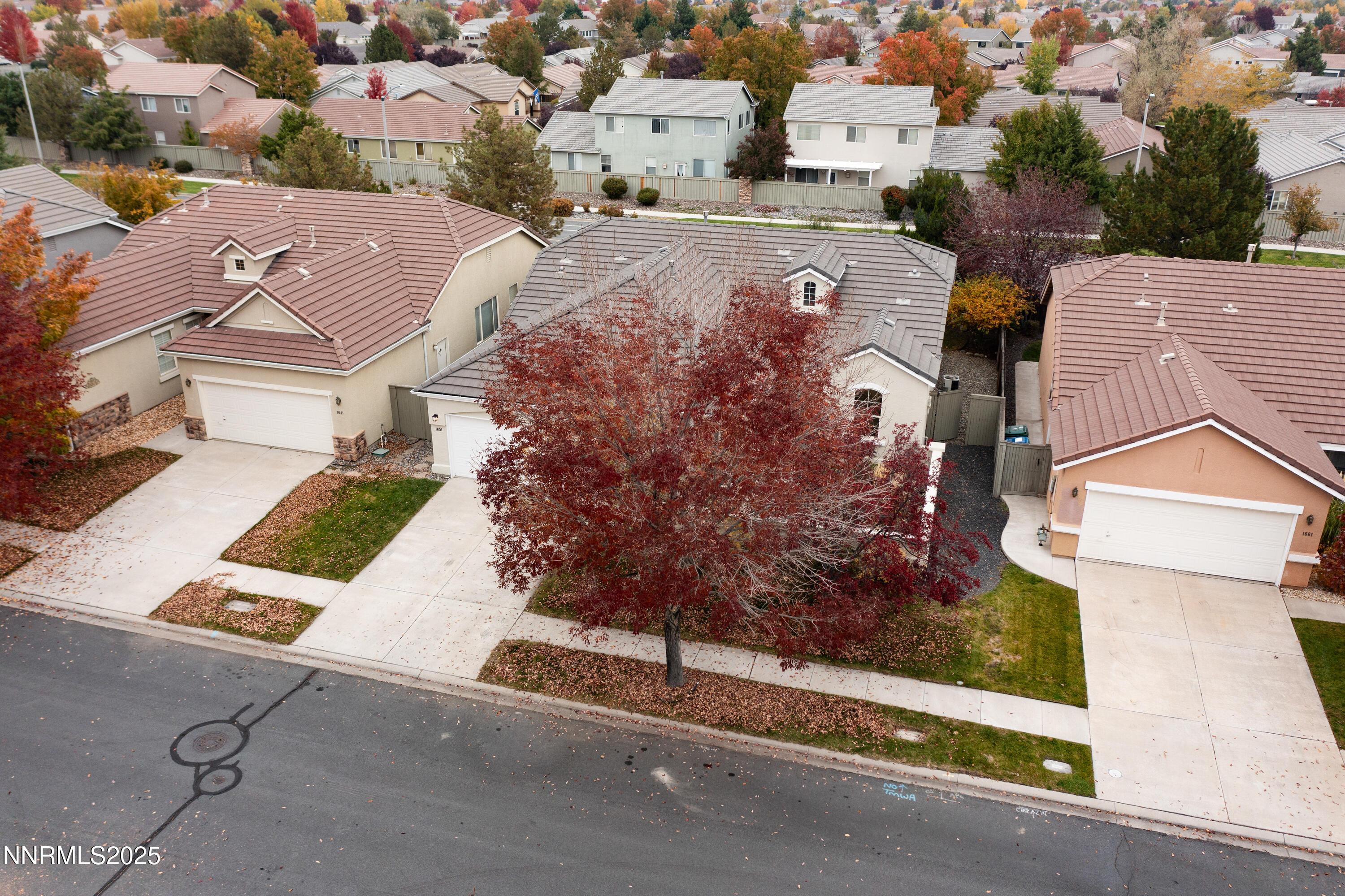1651 Emerald Bay Drive Reno, NV 89521 - Photo 47 of 50 an aerial view of residential houses with outdoor space and parking