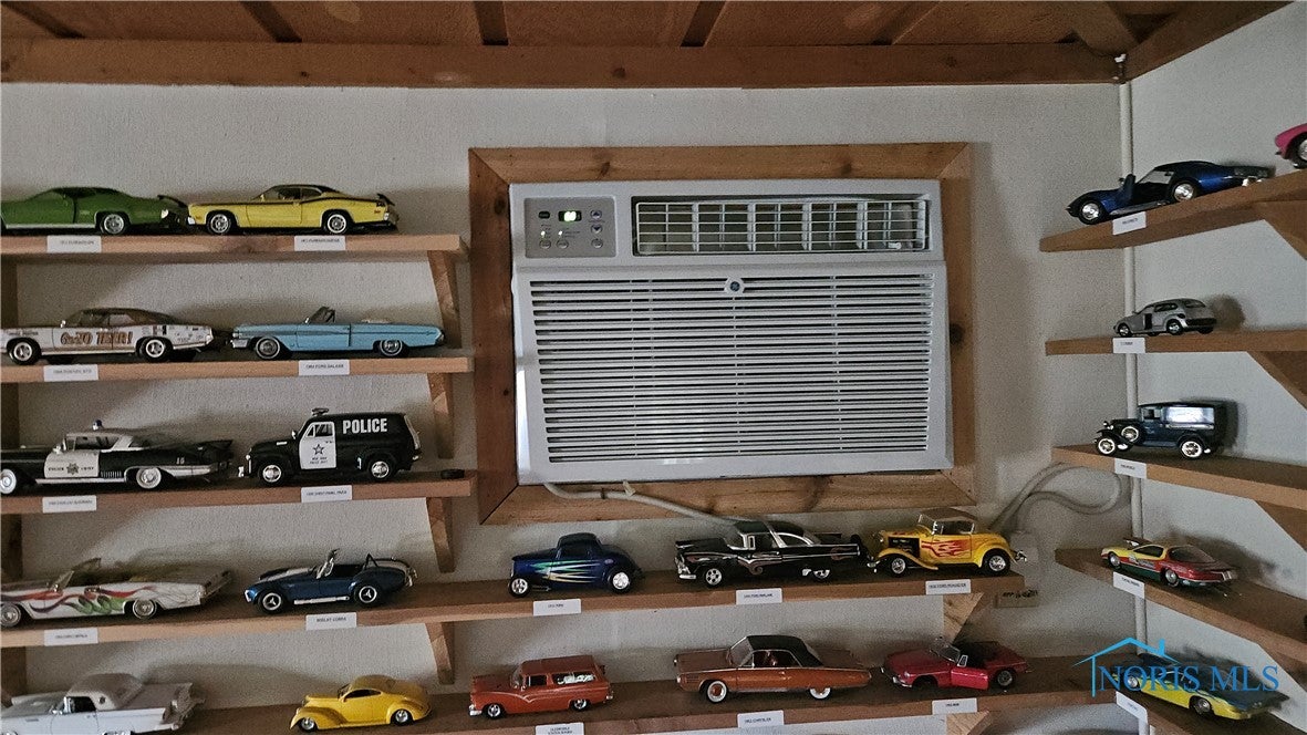 49 North Norden Road Oregon, OH 43616 - Photo 10 of 23 shelves stay , cars are sold . this air unit family room only .