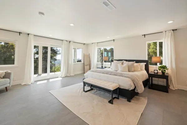 a bathroom with a sink vanity tub and a mirror