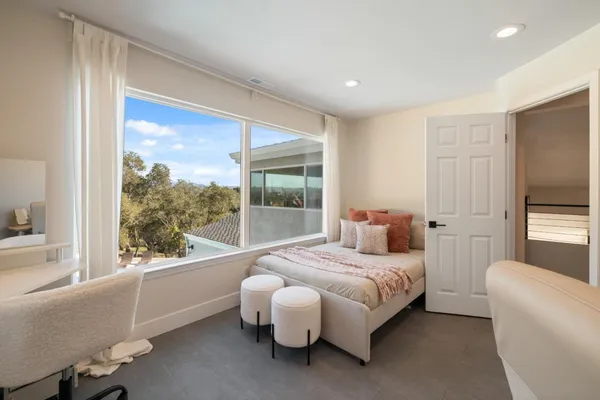 a view of a white house with a yard