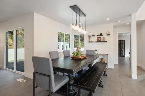 a spacious bedroom with a bed and a couch