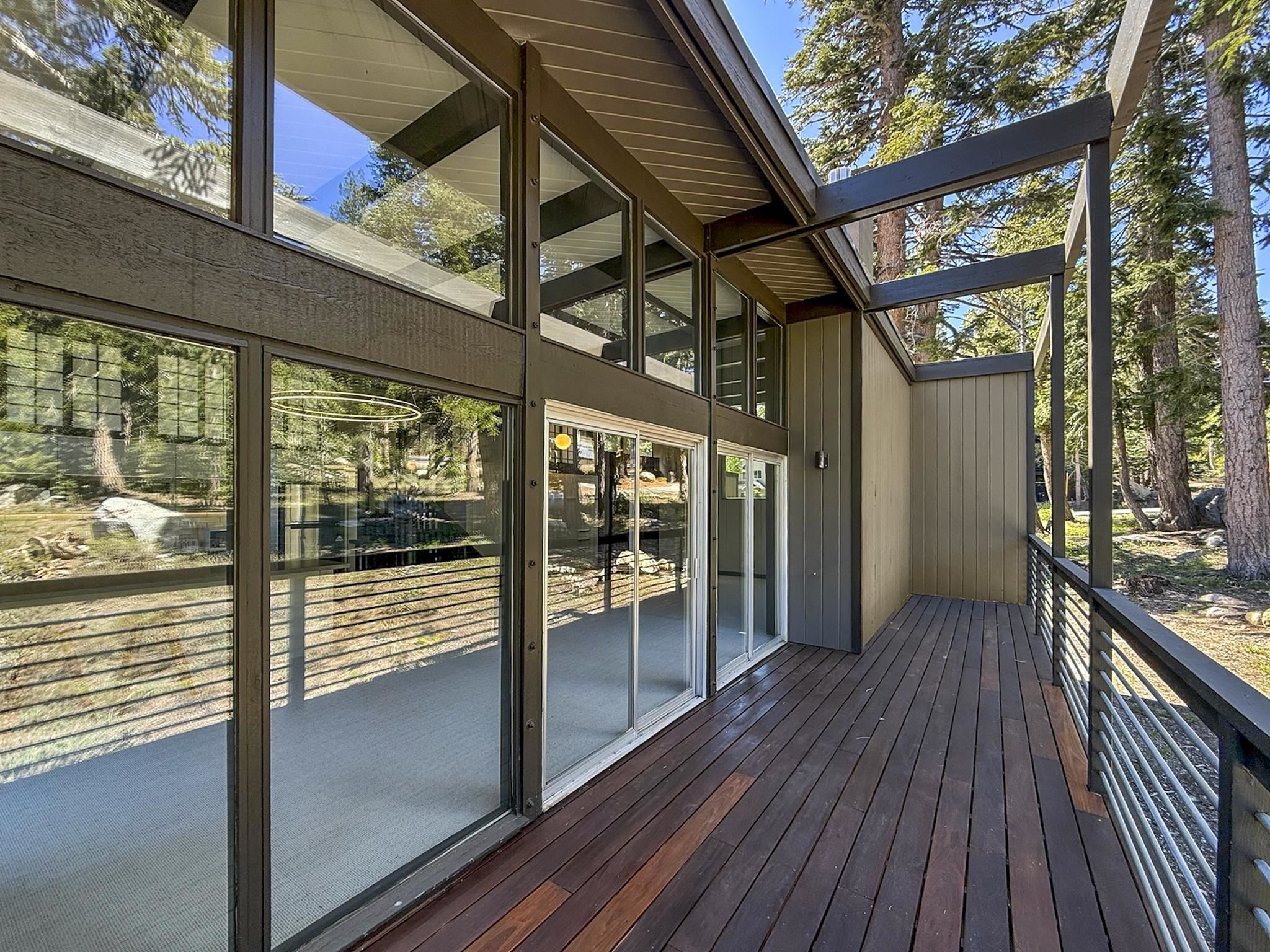 2570 Old Mammoth Road Mammoth Lakes, CA 93546 - Photo 11 of 39 Expansive wood-finish deck with metal bar railing
