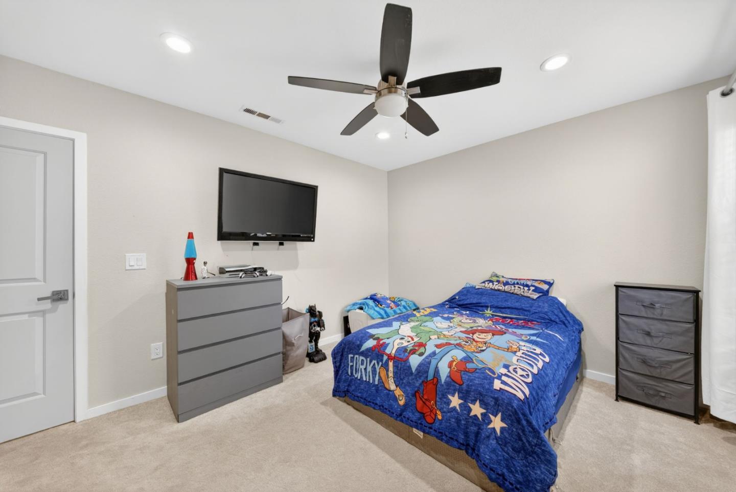 919 Old Canyon Road Fremont, CA 94536 - Photo 26 of 55 a bedroom with a bed and a flat screen tv