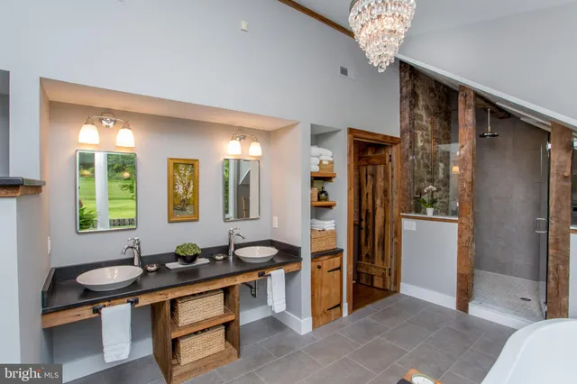 a room with furniture pool view dining table and chairs