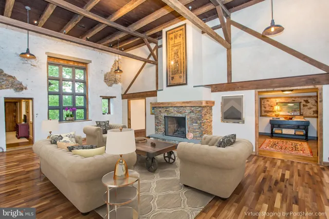 a view of a room with window and wooden floor