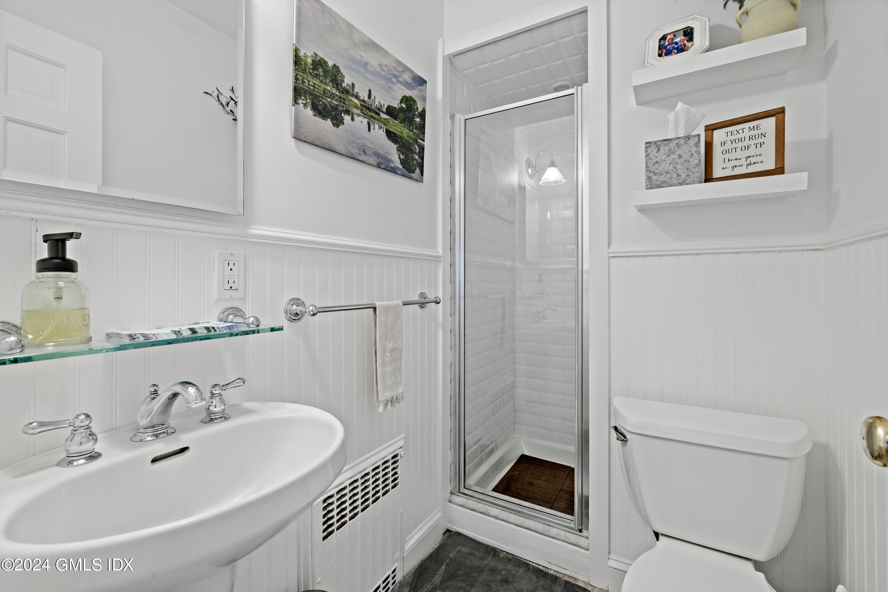 29 Park Place Darien, CT 06820 - Photo 11 of 22 a bathroom with a sink a toilet and shower