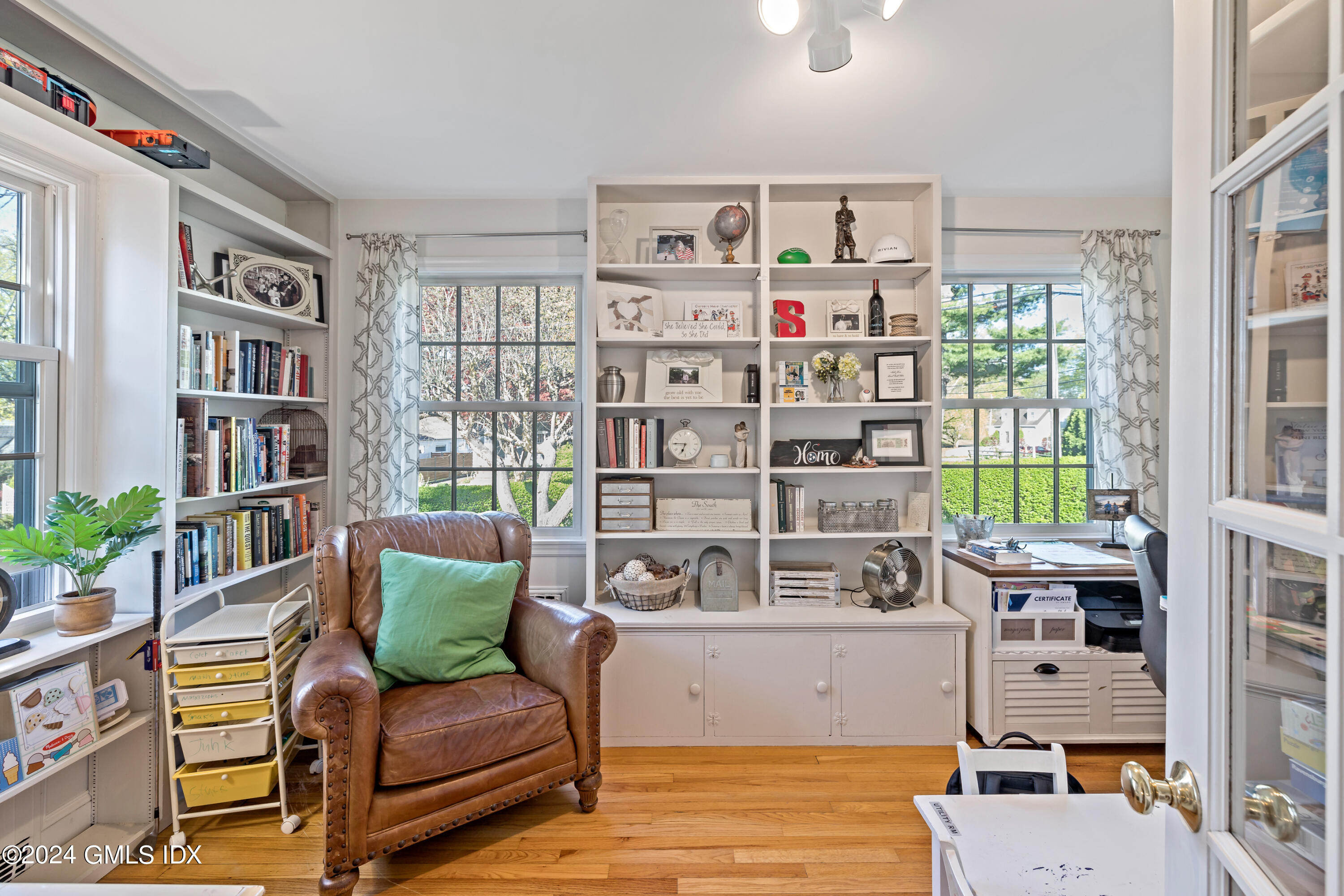 29 Park Place Darien, CT 06820 - Photo 12 of 22 a living room with furniture and a book shelf