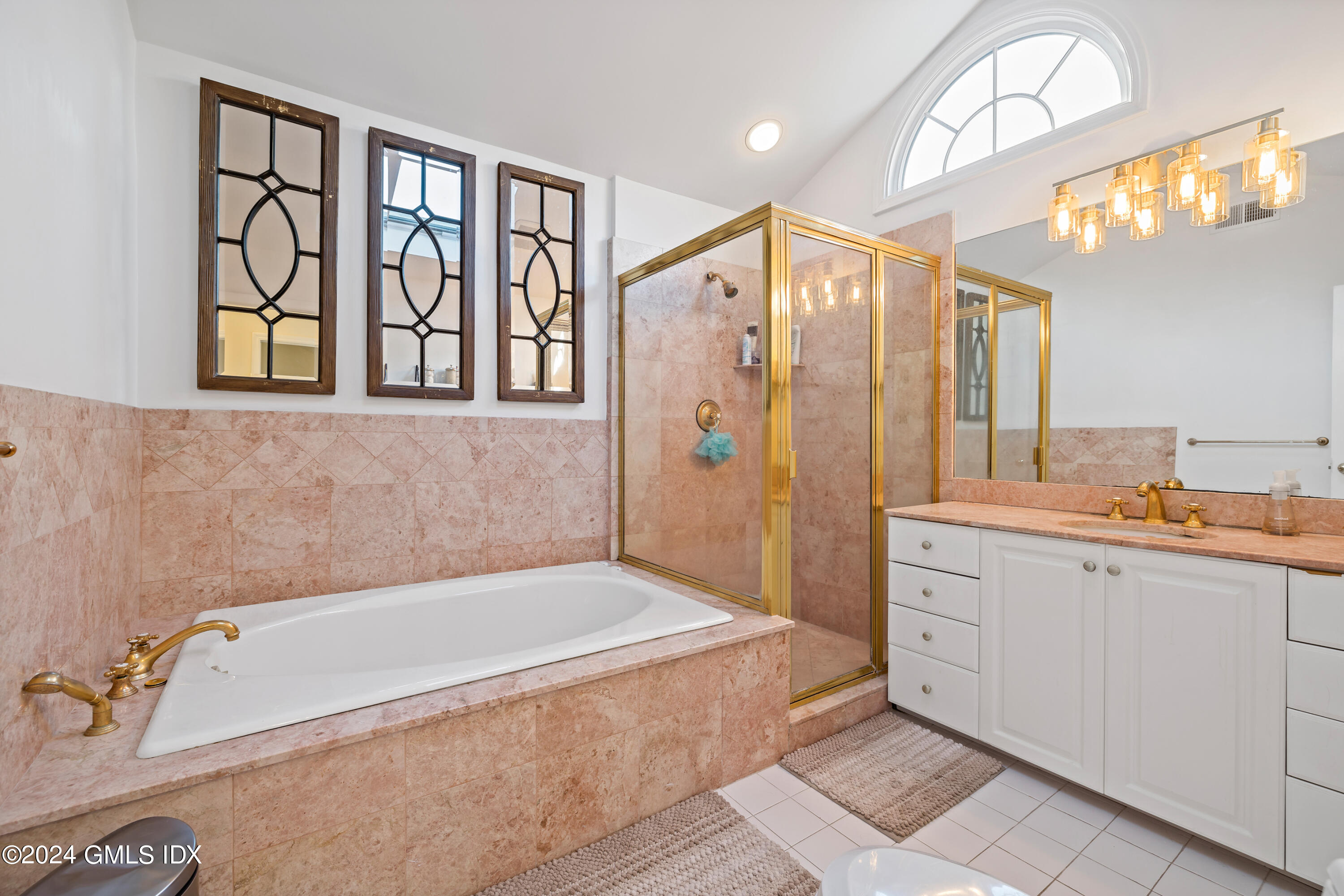 29 Park Place Darien, CT 06820 - Photo 14 of 22 a bathroom with a tub a sink and a window