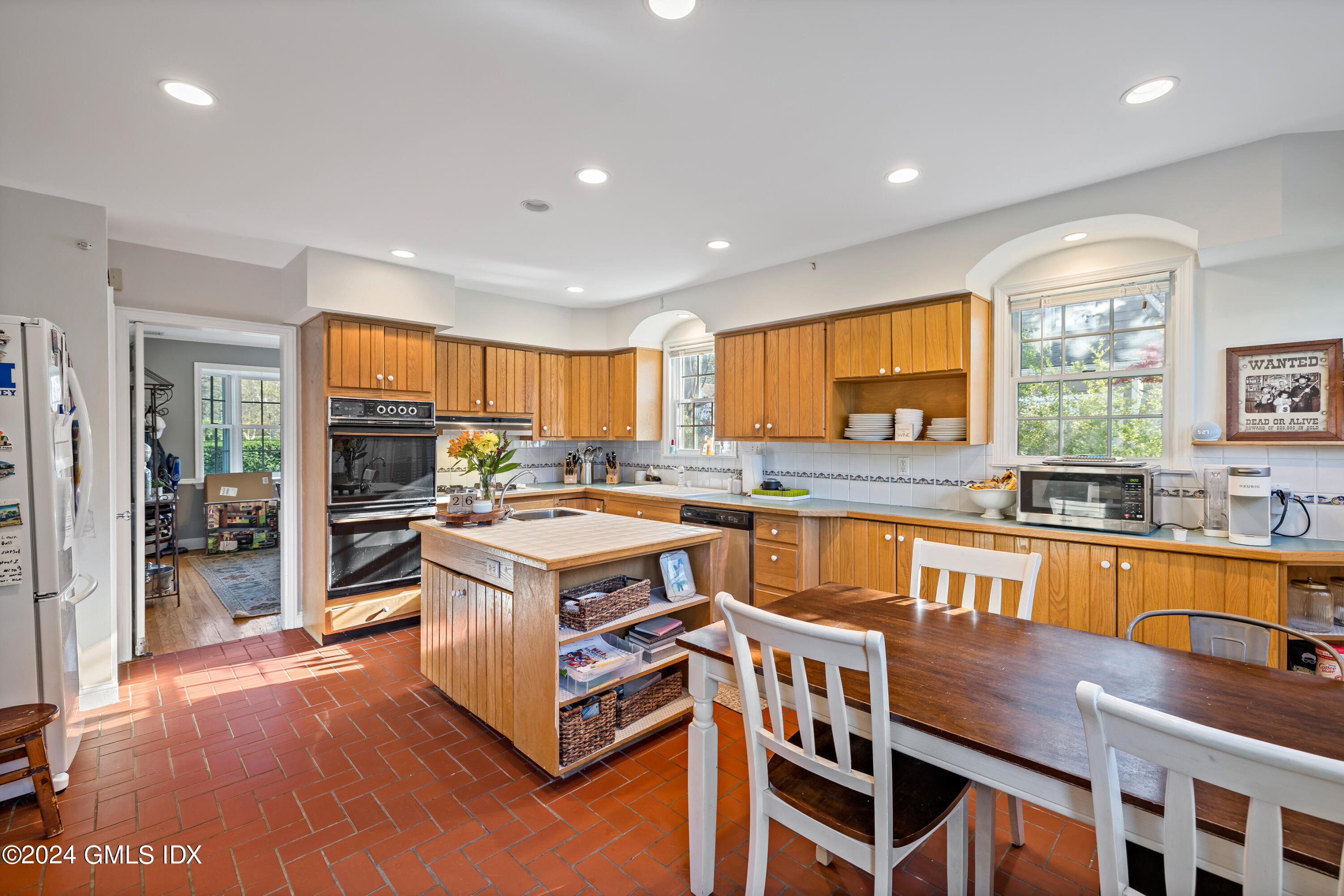 29 Park Place Darien, CT 06820 - Photo 6 of 22 a kitchen with stainless steel appliances granite countertop a stove and a large window