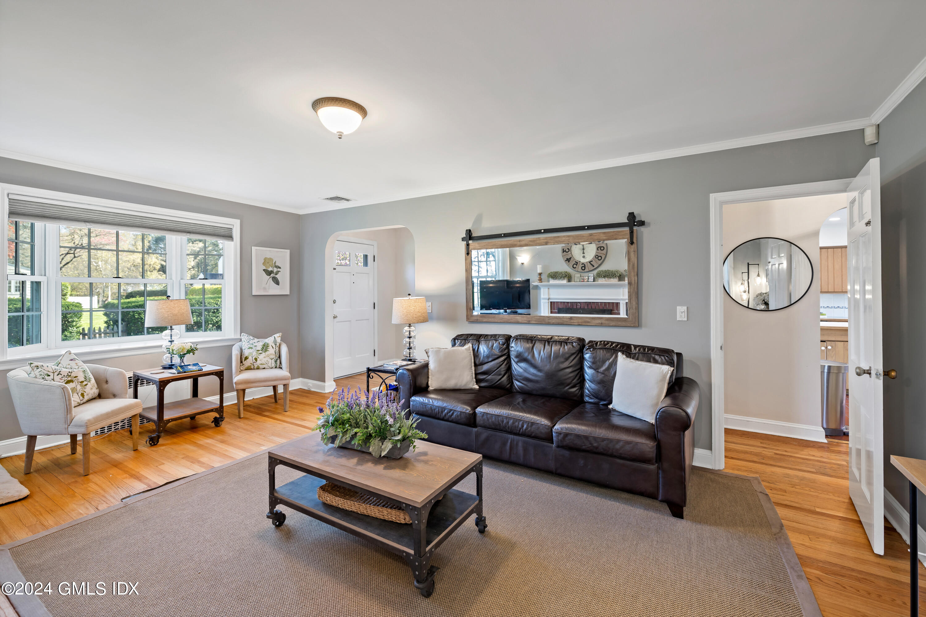29 Park Place Darien, CT 06820 - Photo 9 of 22 a living room with furniture and a large window