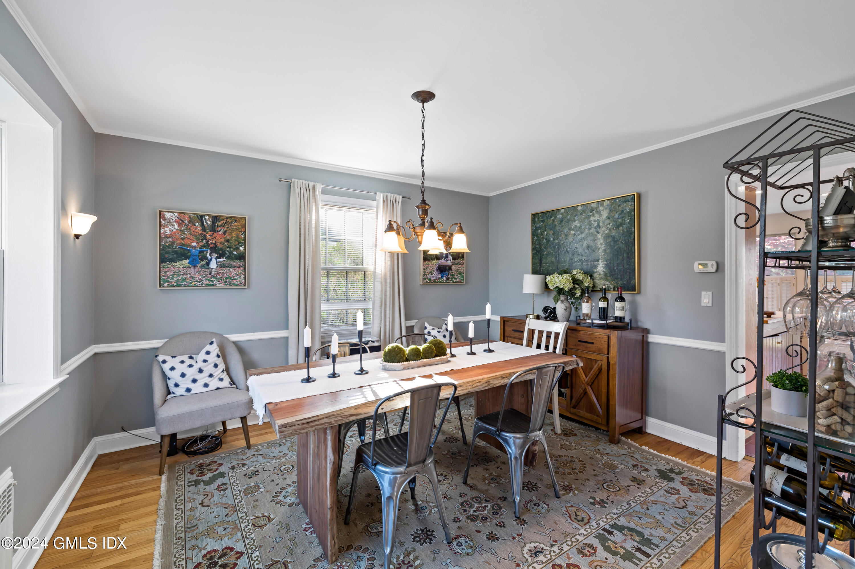 29 Park Place Darien, CT 06820 - Photo 10 of 22 a dining room with furniture a rug and a chandelier