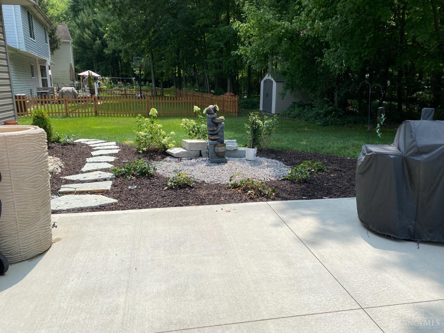 724 Regent Road Cincinnati, OH 45245 - Photo 61 of 67 Summer photo of fountain in patio area.