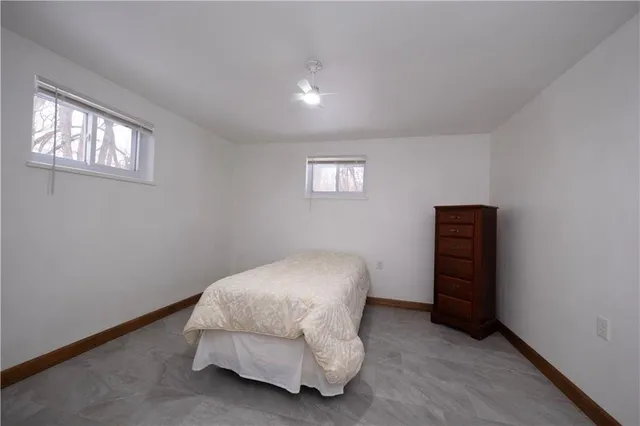 a room with a bed and a window