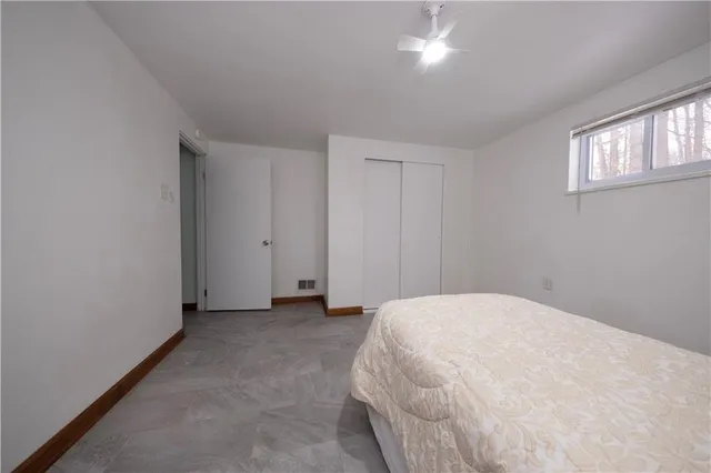 a large white bed in a white room