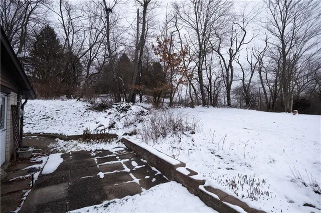 a view of snow on the road