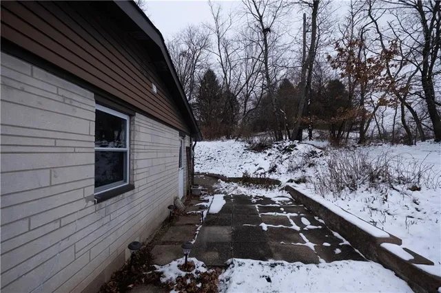 a view of a backyard of the house