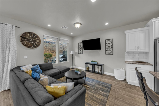 4796 Winged Foot Drive St. George, UT 84770 - Photo 18 of 33 Living area featuring dark wood finished floors and recessed lighting