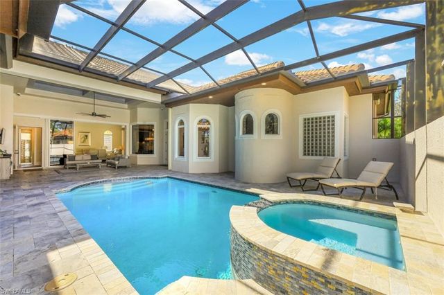 a view of a house with swimming pool