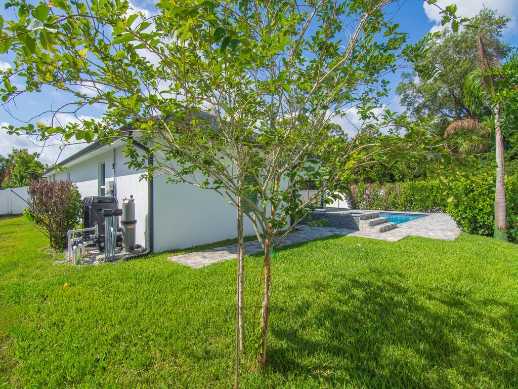 431 Midvale Terrace Sebastian, FL 32958 - Photo 29 of 34 a view of a house with backyard and a tree