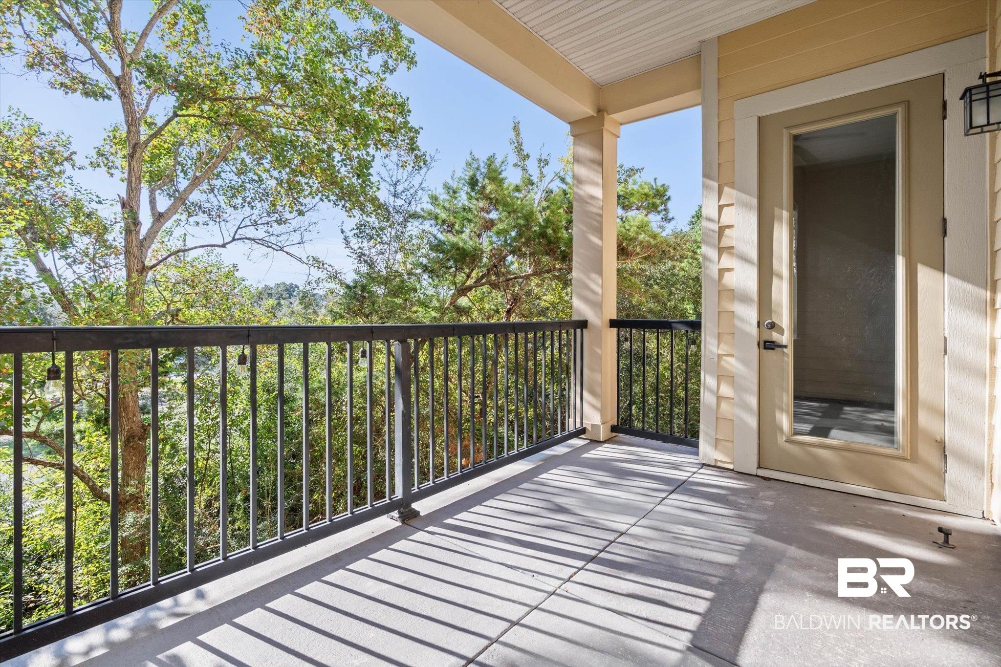 1430 Regency Road, Unit C202 Gulf Shores, AL 36542 - Photo 5 of 27 Balcony Patio overlooking trees