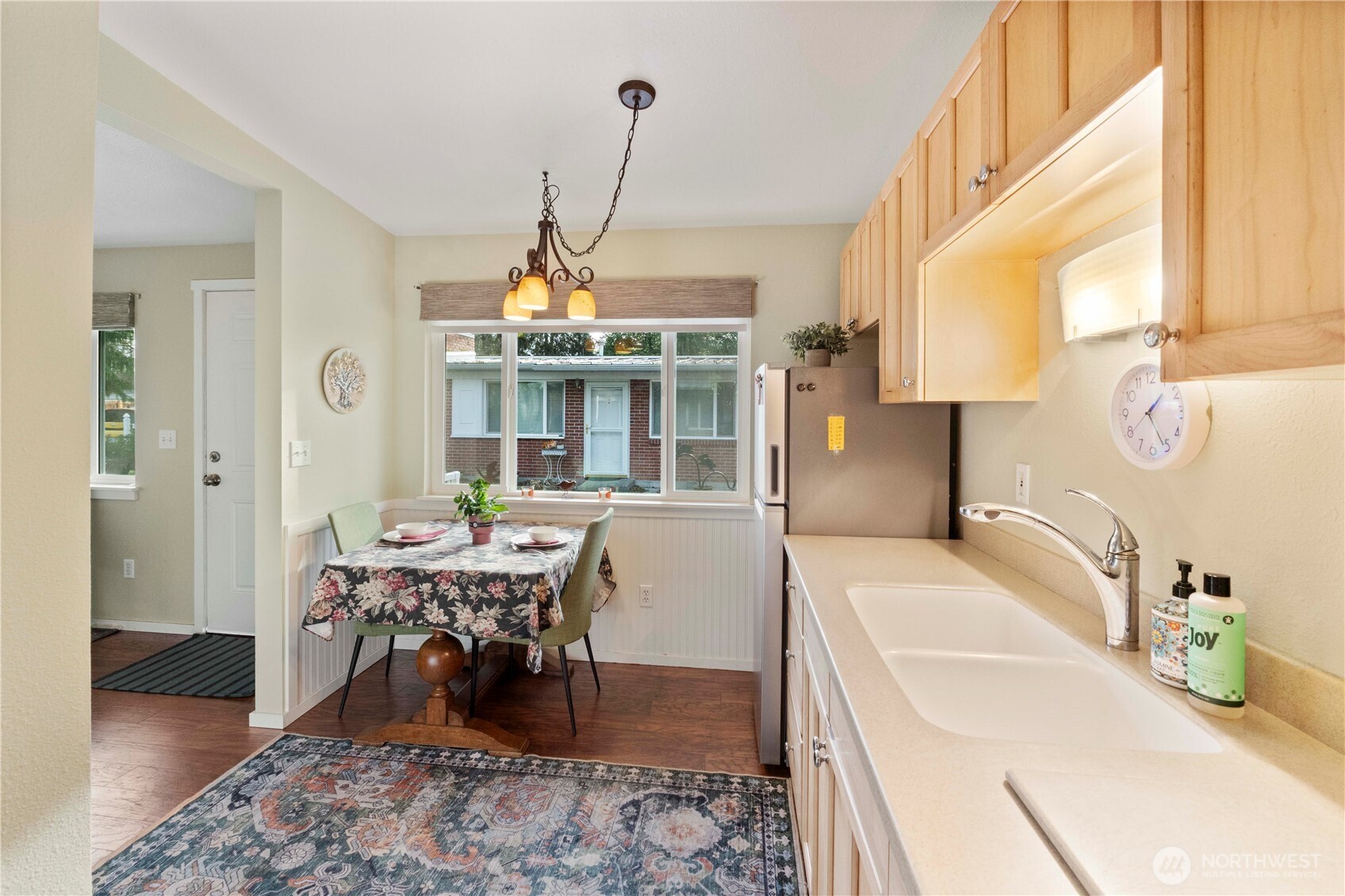 8414 John Dower Road Southwest, Unit 14 Lakewood, WA 98499 - Photo 12 of 33 a view of a dining room with furniture window and wooden floor