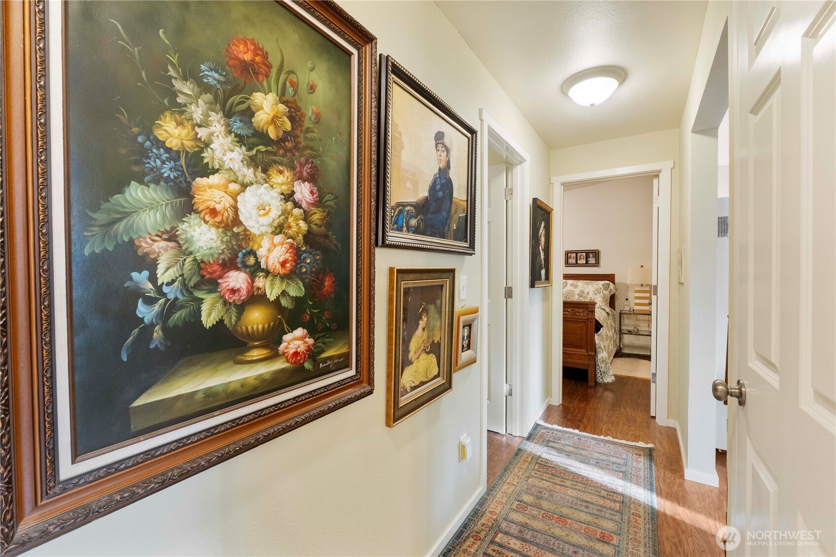 8414 John Dower Road Southwest, Unit 14 Lakewood, WA 98499 - Photo 16 of 33 a view of a hallway with wooden floor and living room
