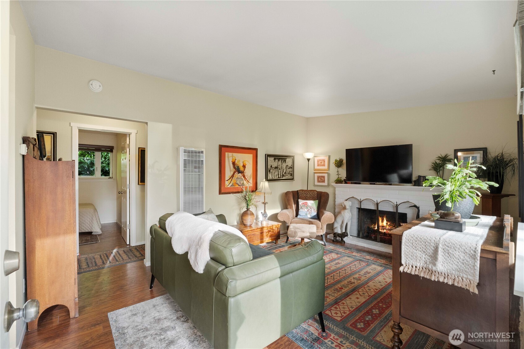 8414 John Dower Road Southwest, Unit 14 Lakewood, WA 98499 - Photo 2 of 33 a living room with furniture a flat screen tv and a fireplace