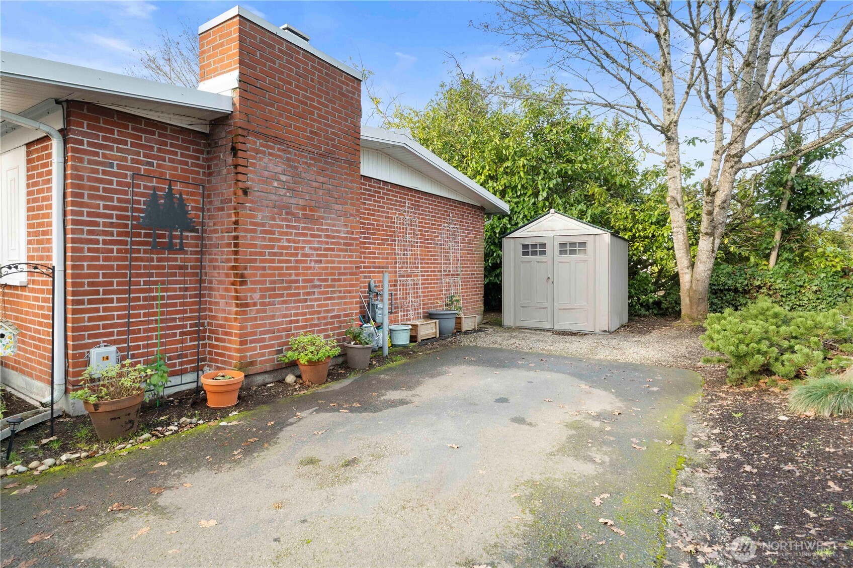 8414 John Dower Road Southwest, Unit 14 Lakewood, WA 98499 - Photo 23 of 33 a front view of a house with a yard and garage