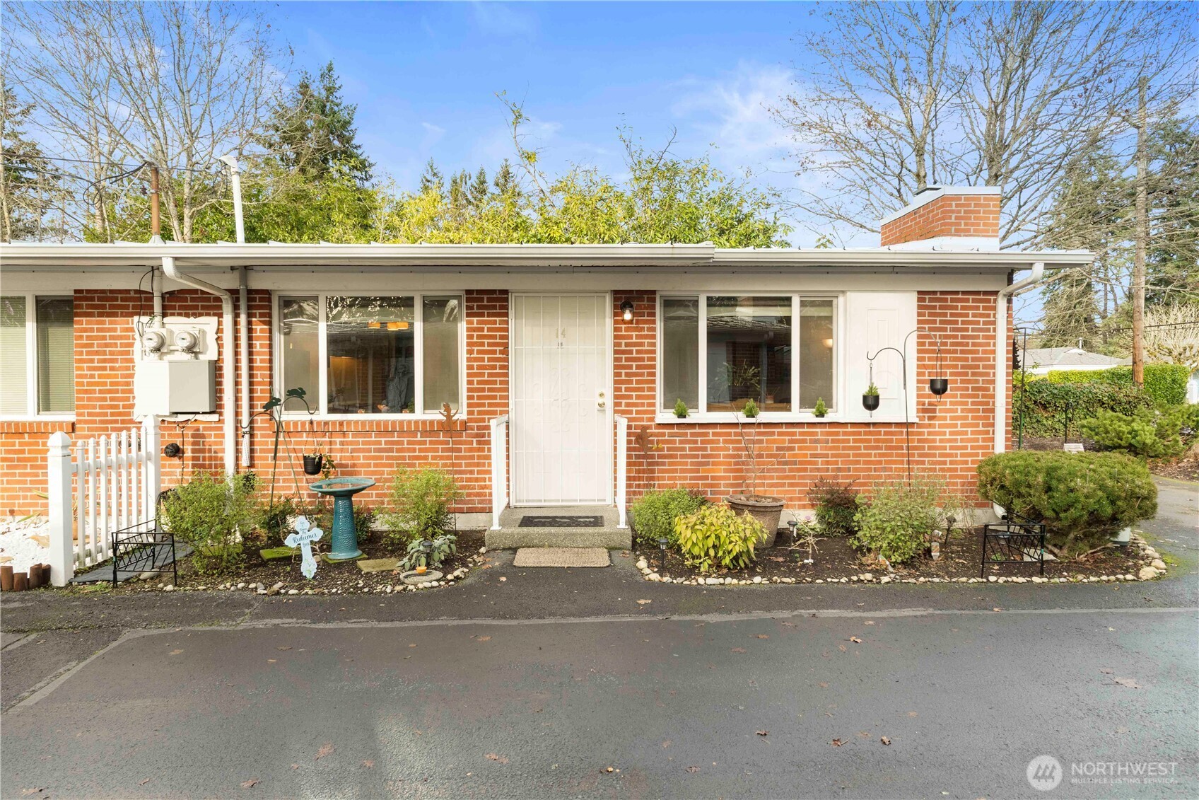 8414 John Dower Road Southwest, Unit 14 Lakewood, WA 98499 - Photo 27 of 33 front view of a house with a street