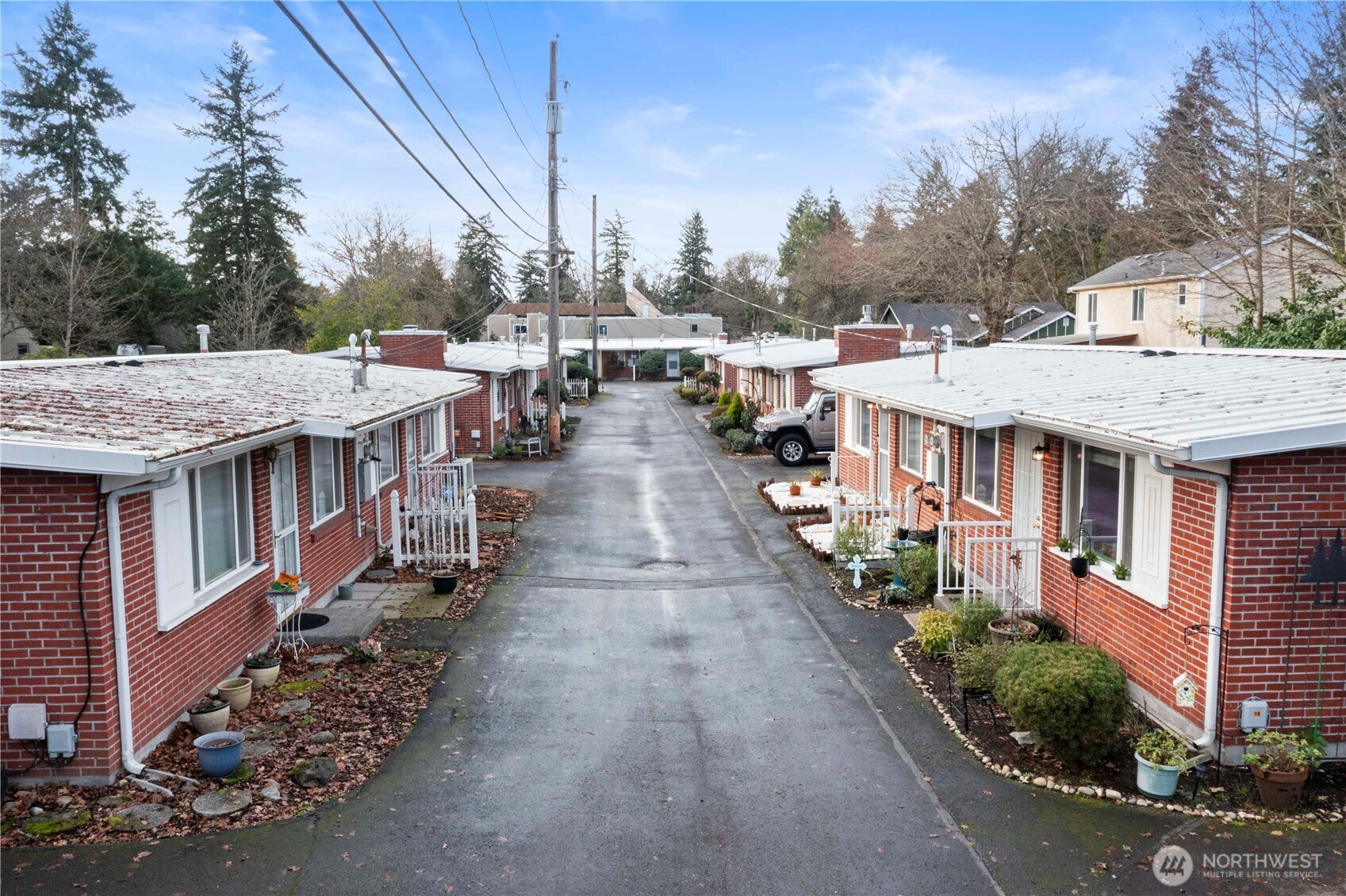 8414 John Dower Road Southwest, Unit 14 Lakewood, WA 98499 - Photo 33 of 33 an aerial view of a house with a yard table and chairs