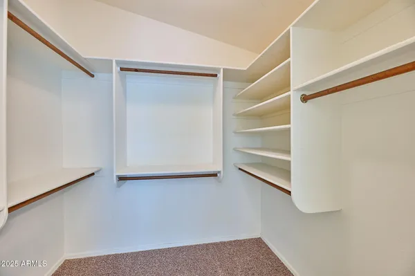 a view of an empty walk in closet
