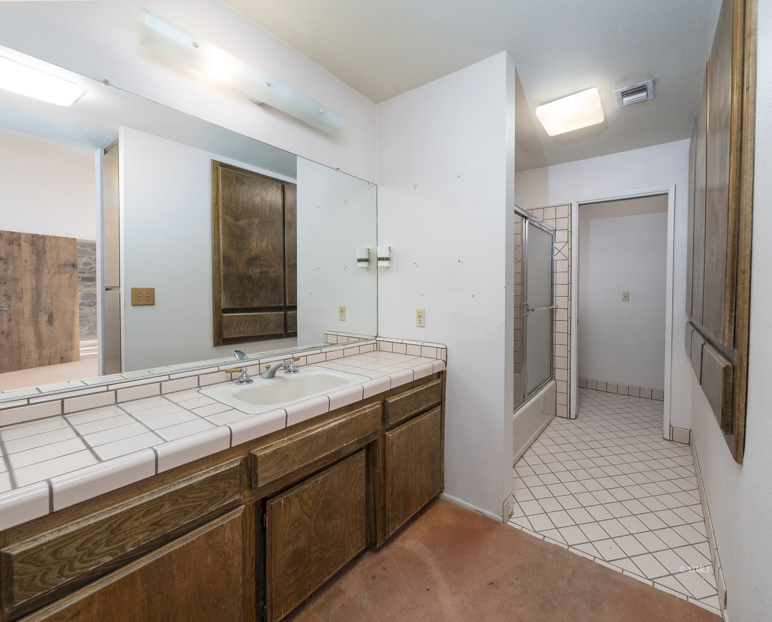 854 Campbell Street Ridgecrest, CA 93555 - Photo 12 of 45 a bathroom with a sink and a mirror