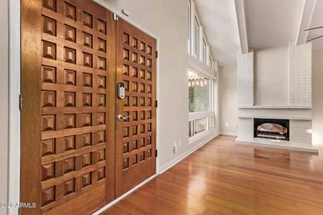 a view of an entryway with wooden floor