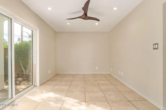 a view of an empty room with glass door