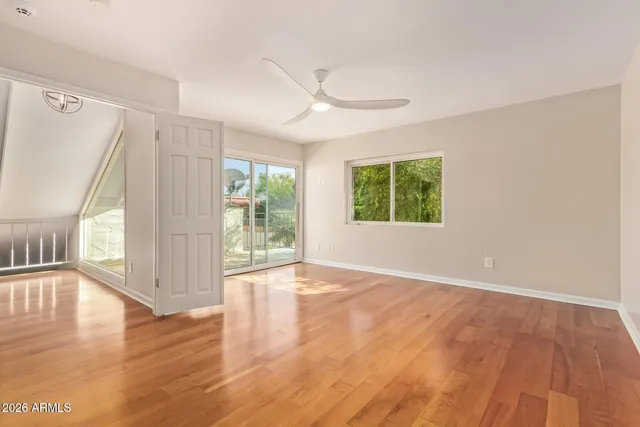a bathroom with a glass shower door and a bathroom