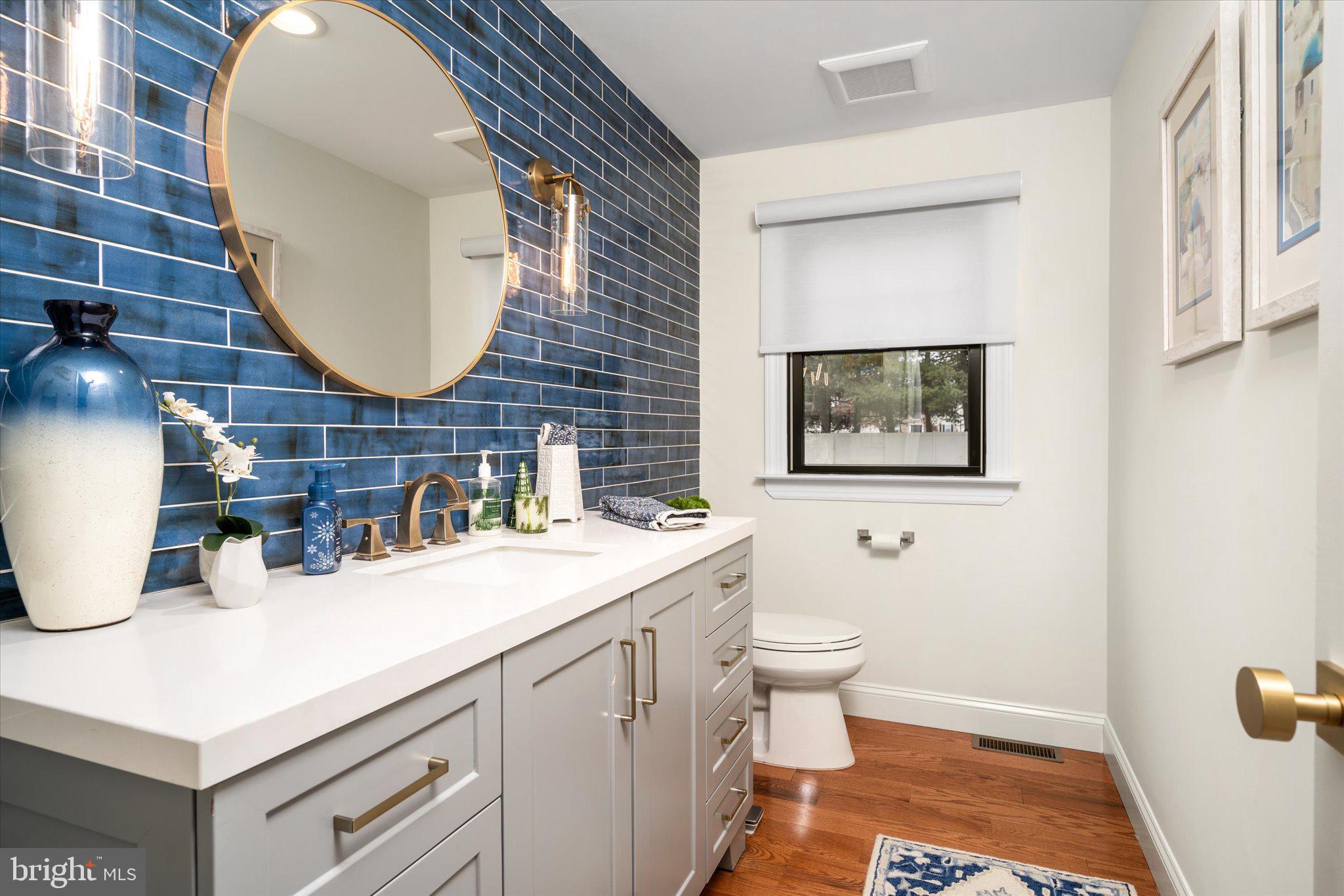 17 Tindall Road Robbinsville, NJ 08691 - Photo 31 of 53 a bathroom with a sink mirror and toilet