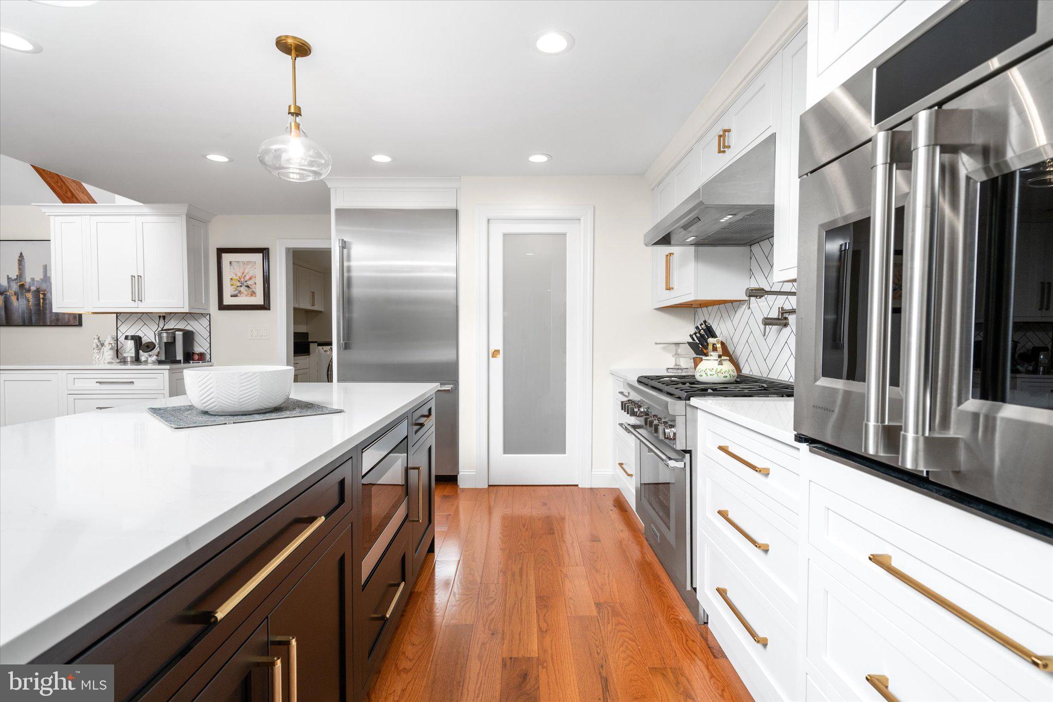 17 Tindall Road Robbinsville, NJ 08691 - Photo 32 of 53 a large kitchen with stainless steel appliances a sink and a stove