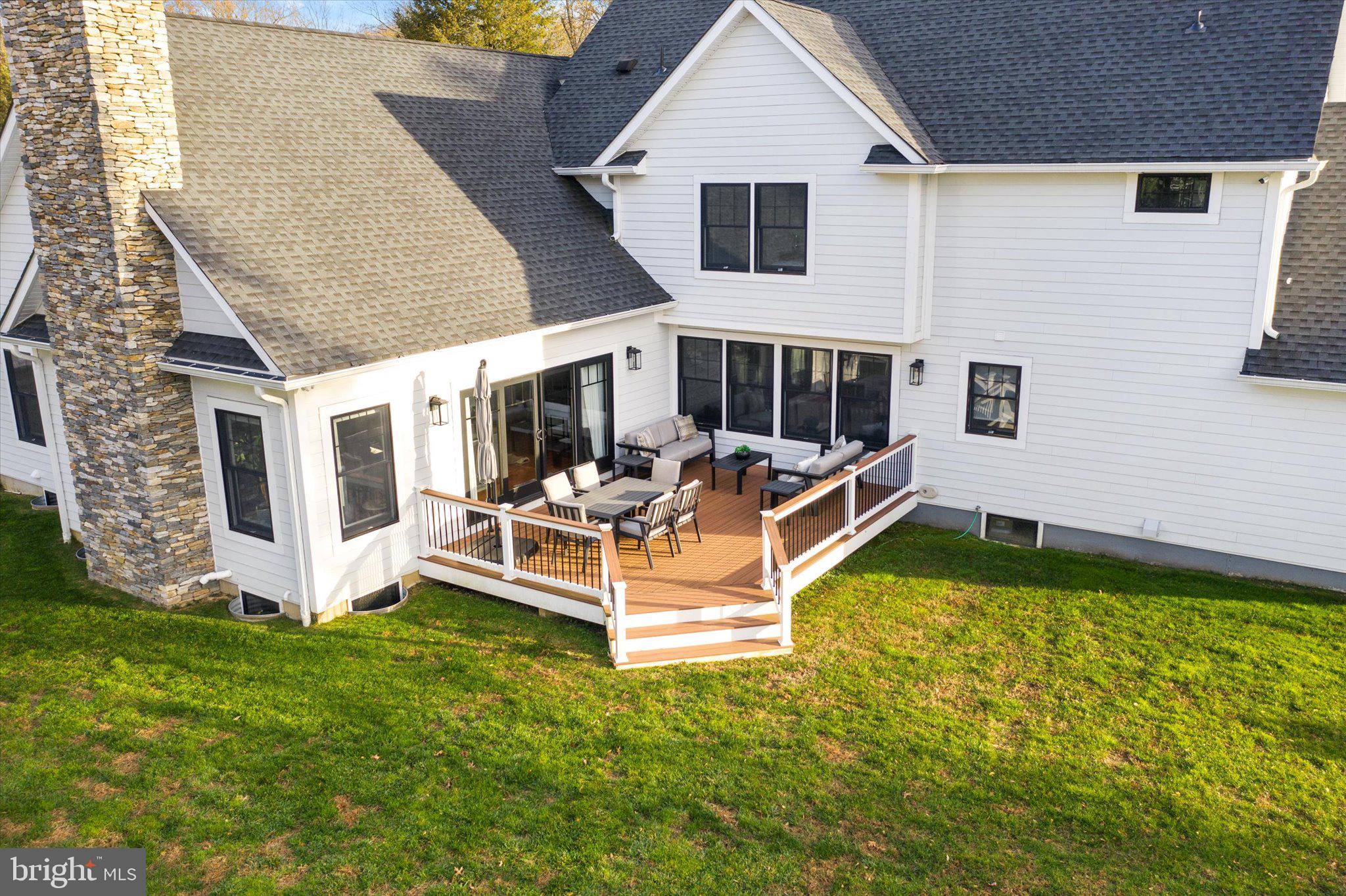 17 Tindall Road Robbinsville, NJ 08691 - Photo 46 of 53 a view of a house with backyard sitting area and garden