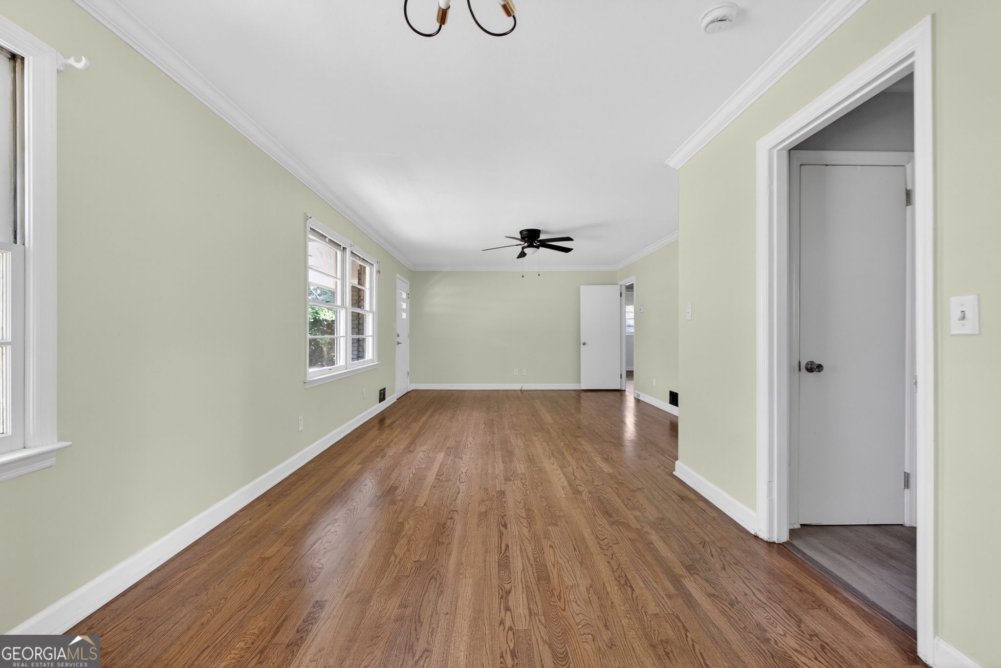 3825 Highway 81 Hampton, GA 30228 - Photo 13 of 25 an empty room with wooden floor and windows
