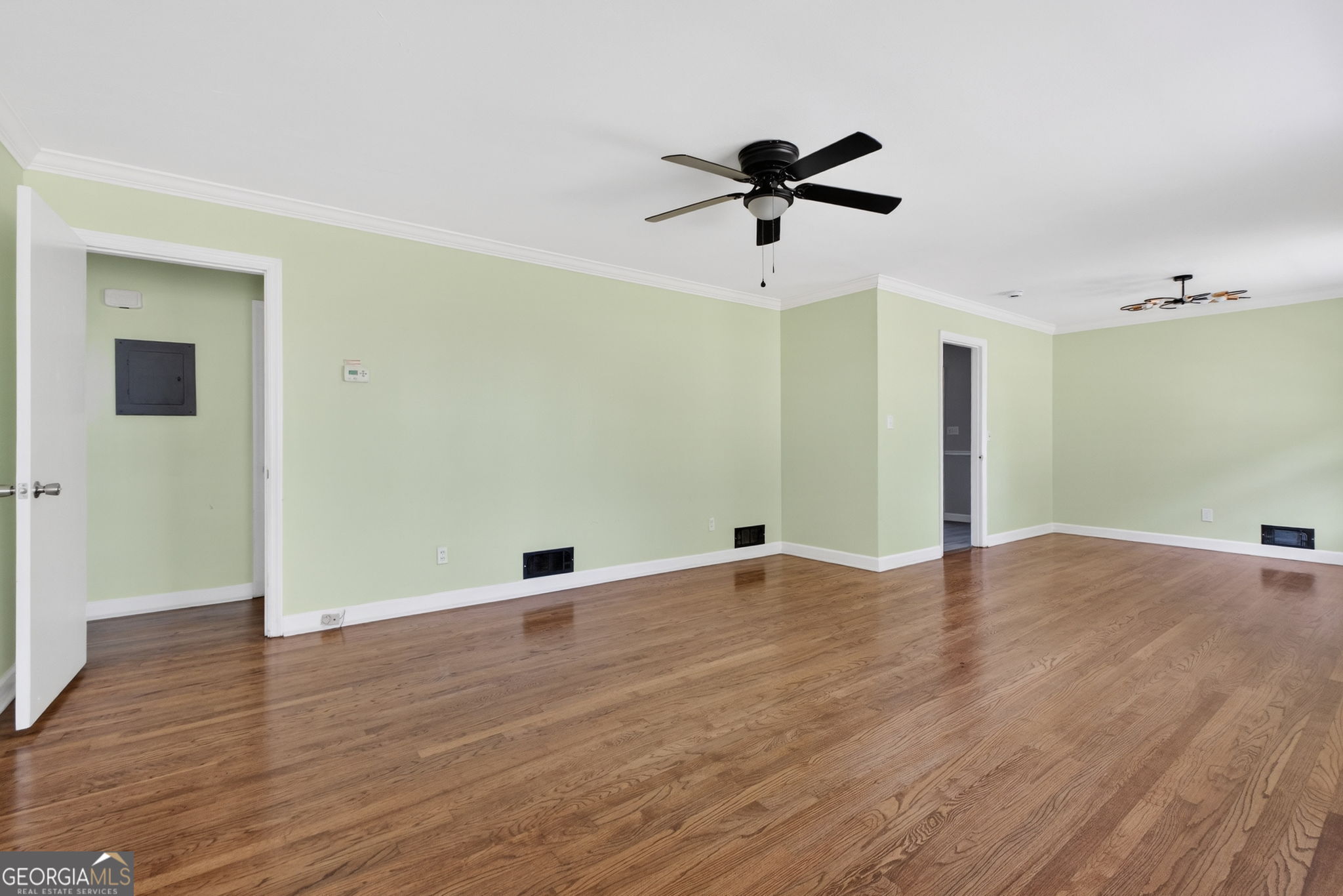 3825 Highway 81 Hampton, GA 30228 - Photo 2 of 25 a view of an empty room with wooden floor