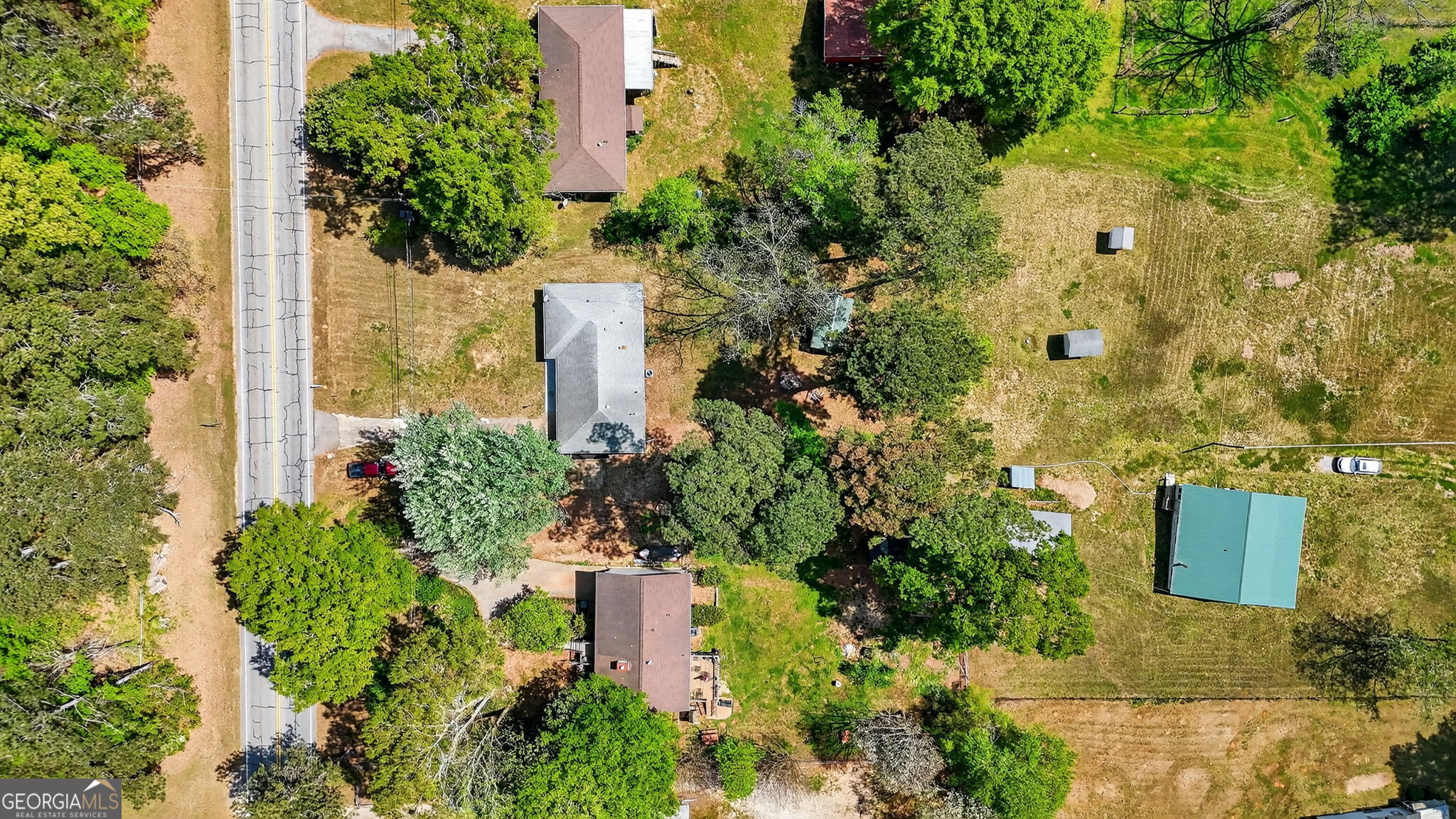 3825 Highway 81 Hampton, GA 30228 - Photo 23 of 25 an aerial view of a house with a yard
