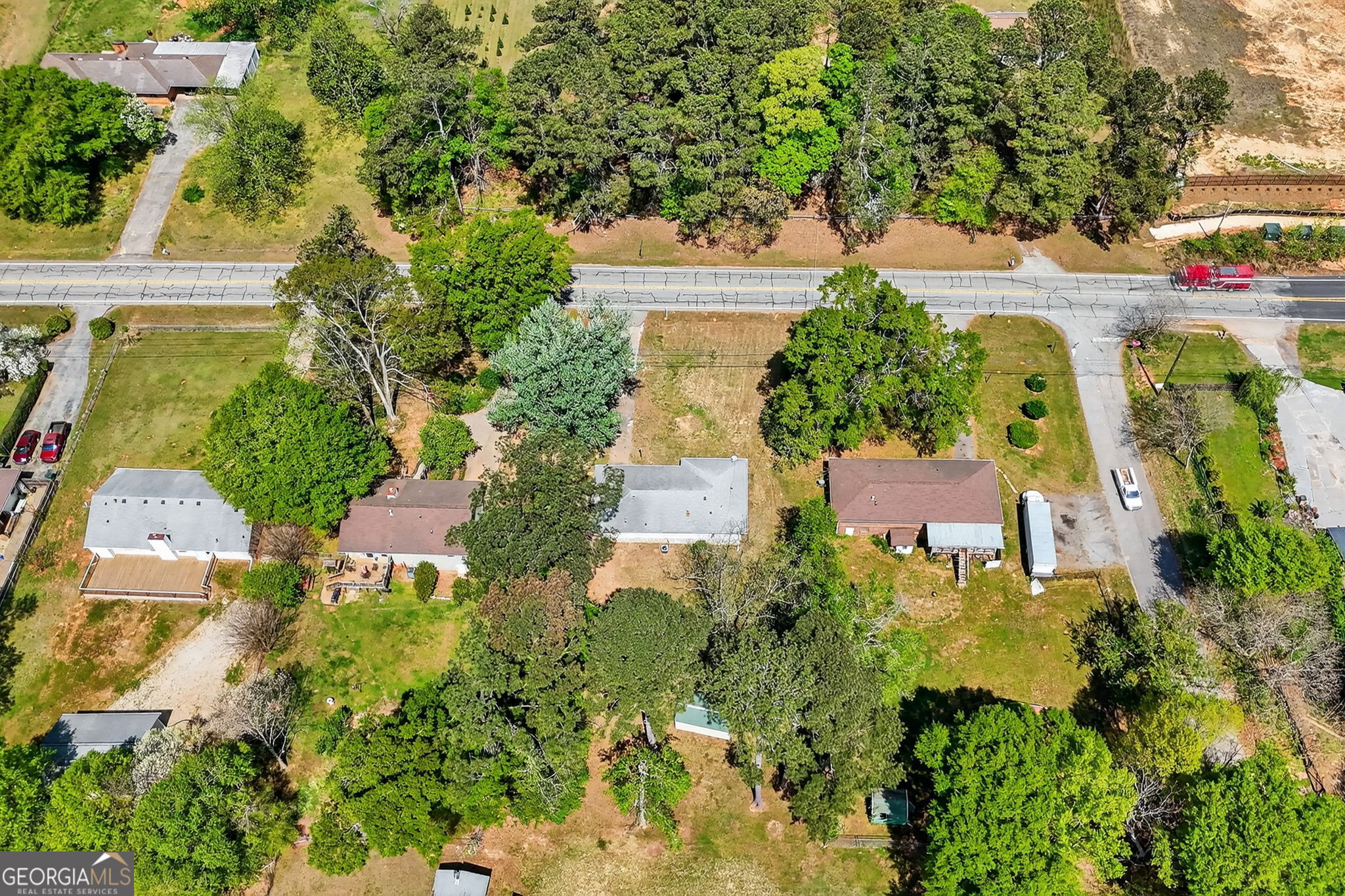 3825 Highway 81 Hampton, GA 30228 - Photo 24 of 25 an aerial view of residential houses with outdoor space and street view