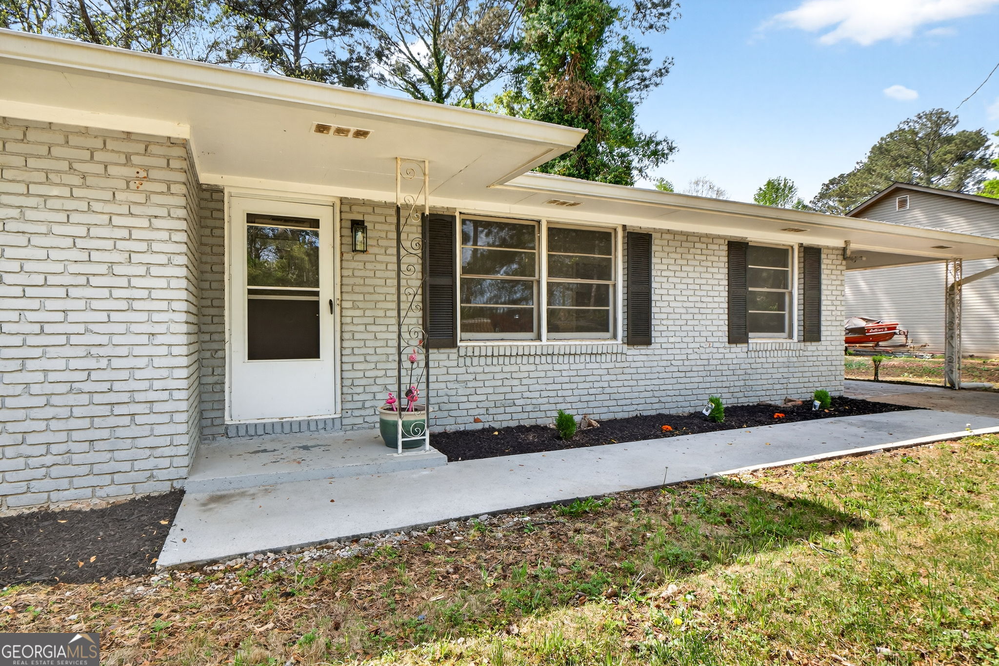 3825 Highway 81 Hampton, GA 30228 - Photo 6 of 25 a front view of a house with garden