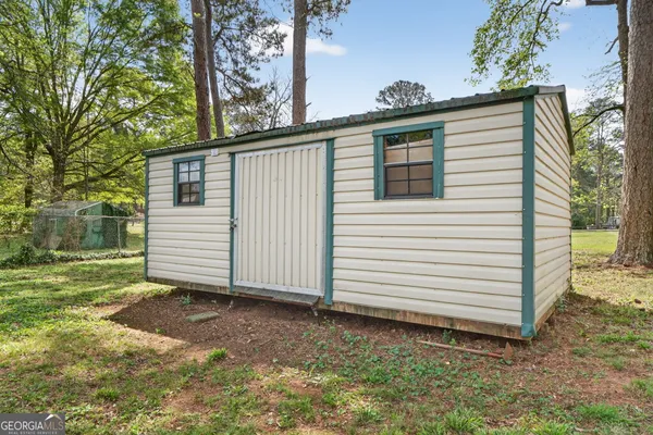 a view of a house with a yard and garage