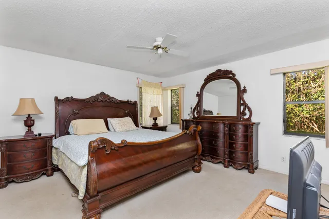 a bedroom with bed and window