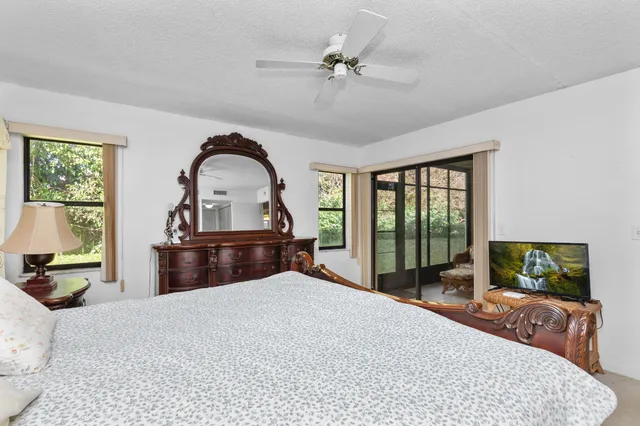 a bed room with a bed and a television