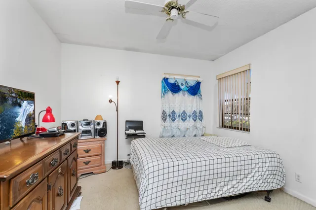 a bedroom with furniture and a bed