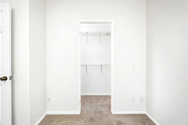 a front view of a building with a road