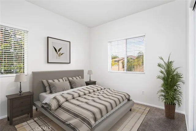 an aerial view of residential houses with outdoor space and lake view