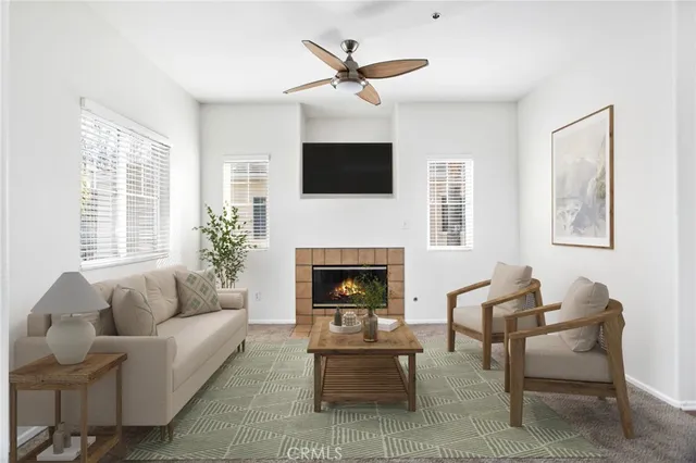 a view of a dining room with furniture a chandelier and wooden floor